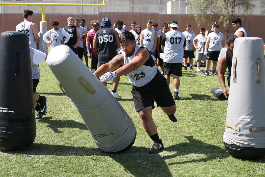 Blaze Homalon, Desert OasisHigh’s defensive tackle, hits a bag as local Clark County a ...