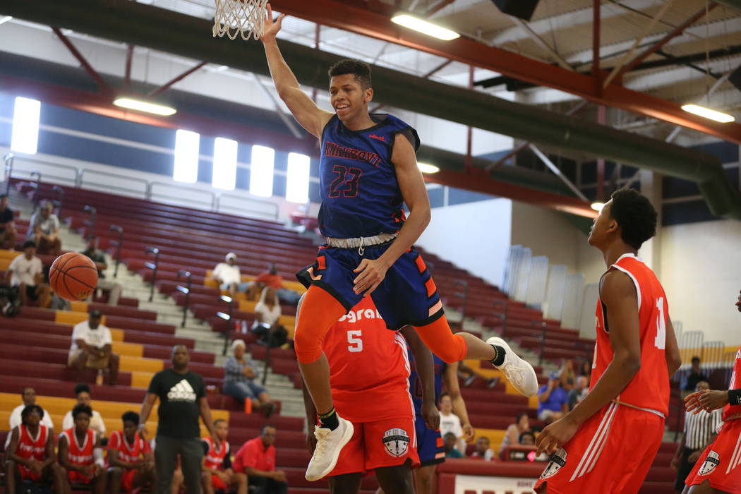 Las Vegas Knicks guard Nick Blake is fouled (23) during his basketball game at Del Sol Acade ...