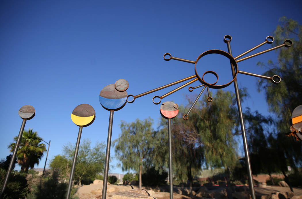 Artist Randy Mendre's sculpture "Solar Walk" is displayed at at the corner of North B ...