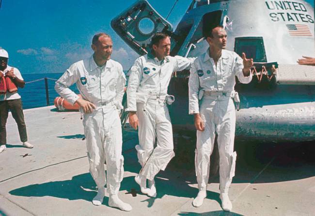 FILE - In this 1969 file photo, Apollo 11 astronauts stand next to their spacecraft in 1969, f ...