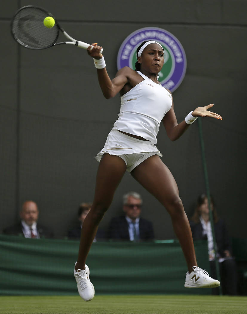 United States' Cori "Coco" Gauff returns to United States's Venus Williams in a Women ...