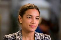 Rep. Alexandria Ocasio-Cortez, D-N.Y., prepares to do a television interview on Capitol Hill, T ...