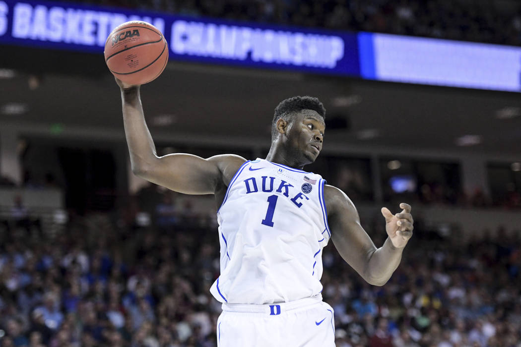 Duke forward Zion Williamson (1) grabs a rebound against Central Florida during the first half ...