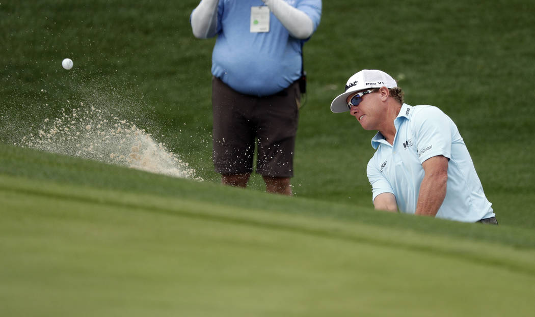 Charley Hoffman plays a shot from a bunker on the second hole during the final round of the Tex ...