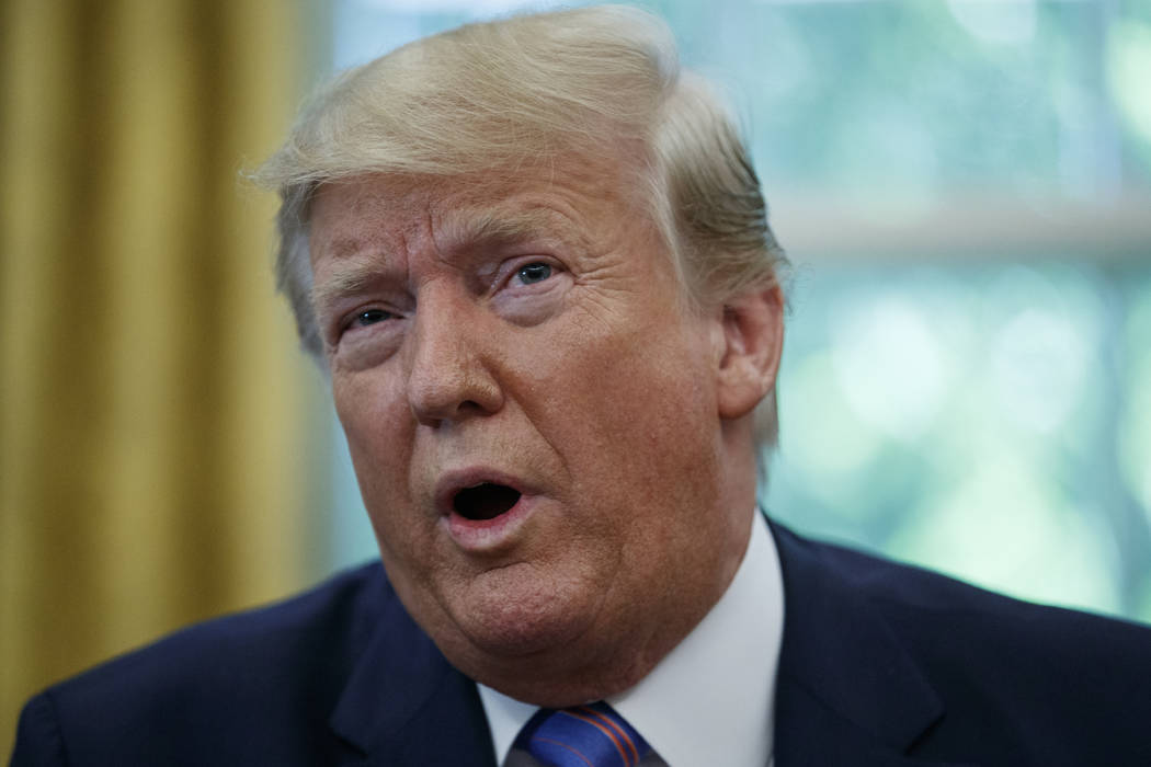 President Donald Trump speaks during a signing ceremony in the Oval Office of the White House i ...