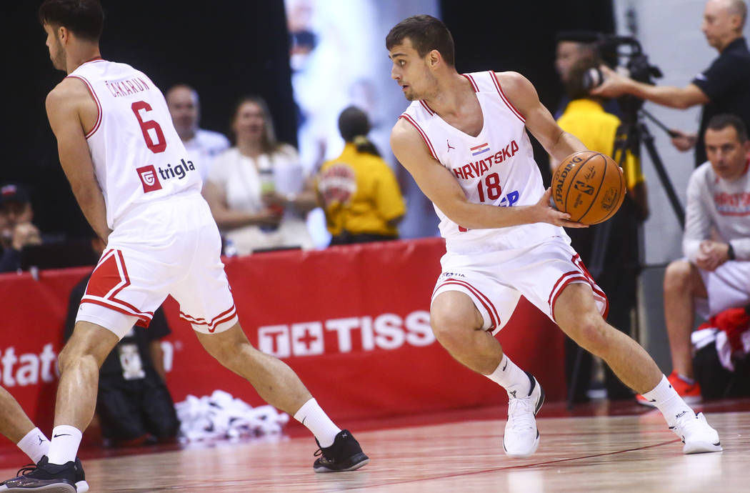 Croatia's Roko Badzim (18) moves the ball against the Detroit Pistons' during the first quarter ...