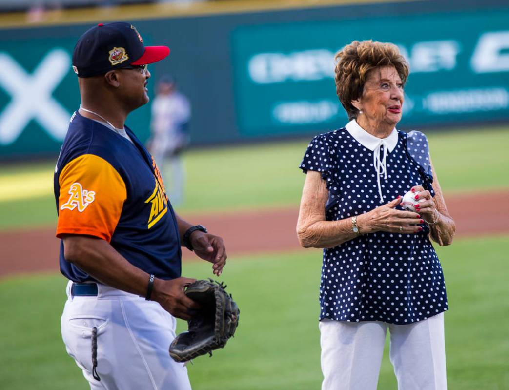 Ninety-five-year-old U.S. Marine Corps veteran Gloria Saucier, who served in World War II, righ ...