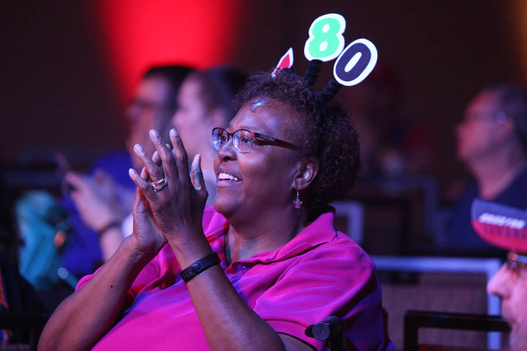 Debbie Hughes, of Las Vegas, cheers during the 2019 Dafabet US Darts Masters at Mandalay Bay on ...