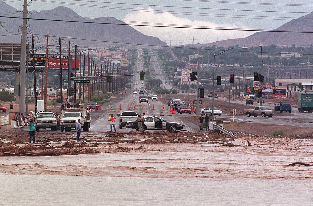 Flood waters cross Boulder Highway just north of Russel Road. The road was blocked by Metro Pol ...