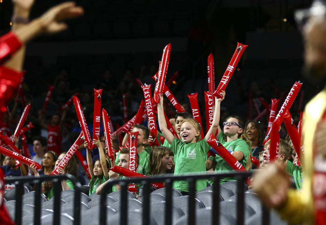 Children cheer at the start of a WNBA basketball game betweent he Las Vegas Aces and Chicago Sk ...