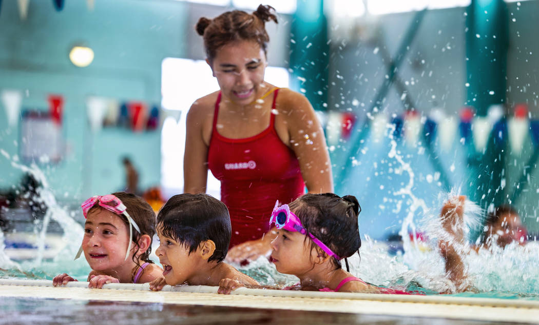 Lorelai Zimring, 5, from left, Stefan Flores, 4, and Ariana Villeda, 4, practice together as th ...