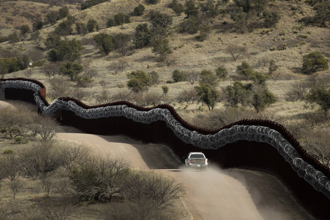 FILE - This March 2, 2019, file photo, shows a Customs and Border Control agent patrolling on t ...