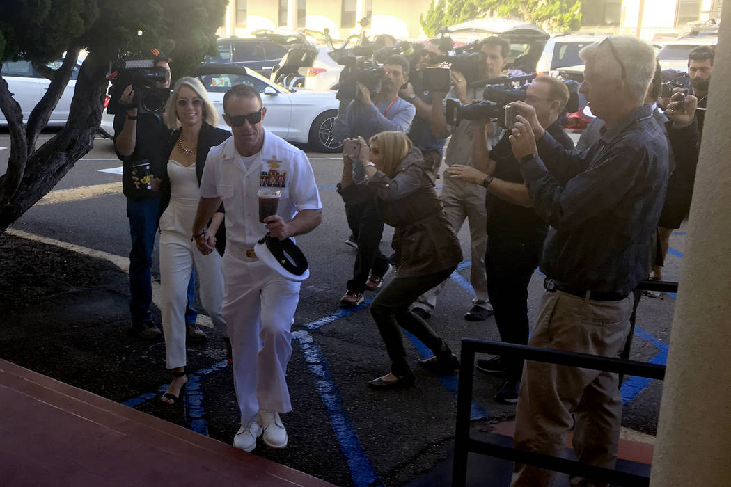 Navy Special Operations Chief Edward Gallagher, center right, walks with his wife, Andrea Galla ...