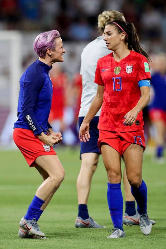 United States' Megan Rapinoe, left, celebrates with teammate Alex Morgan their team's victory a ...