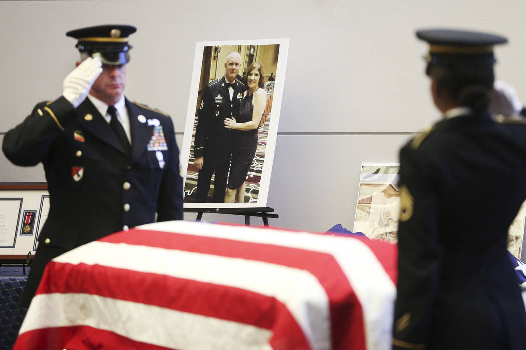 Nevada Army National Guard Sgt. 1st Class Patrick Johnson, left, and Staff Sgt. Brittney Lynch ...