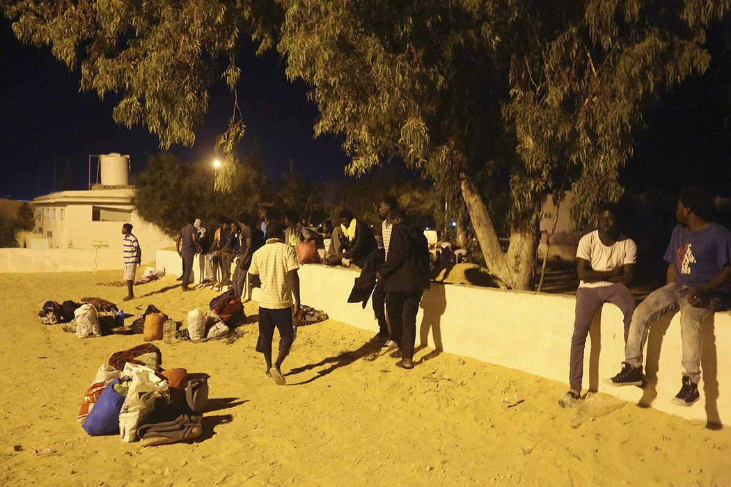 Migrants, who were not affected by an airstrike, take shelter in Tajoura, east of Tripoli Wedne ...