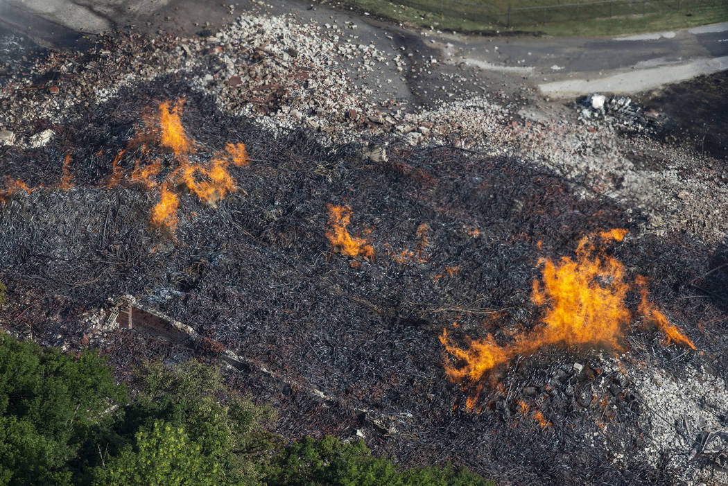 Flames and smoke rise from a bourbon warehouse fire at a Jim Beam distillery in Woodford County ...