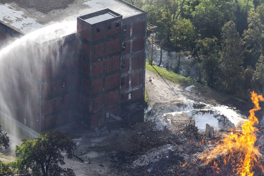 Flames and smoke rise from a bourbon warehouse fire at a Jim Beam distillery in Woodford Count ...