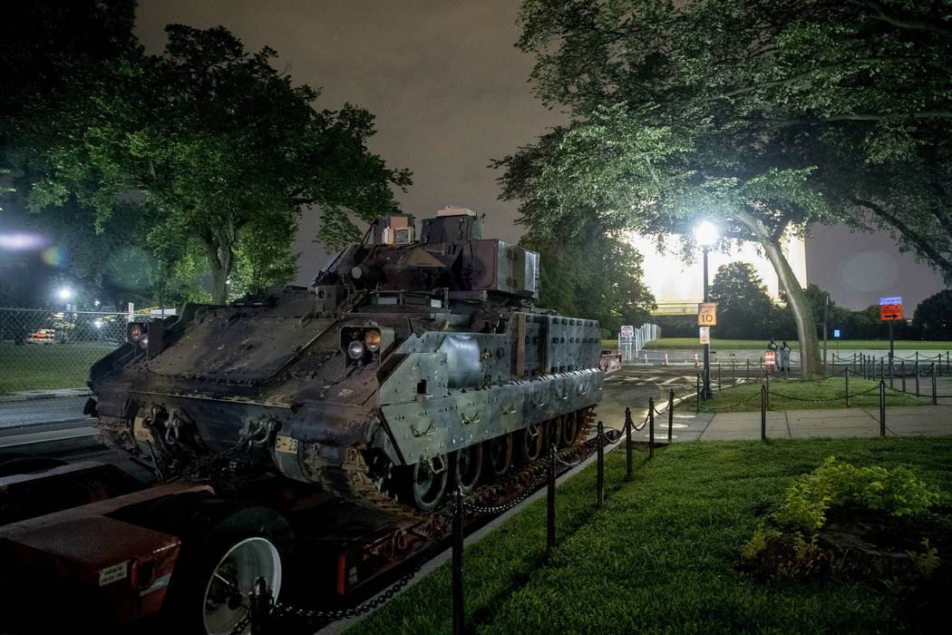 One of two Bradley Fighting Vehicles is parked next to the Lincoln Memorial before President Do ...