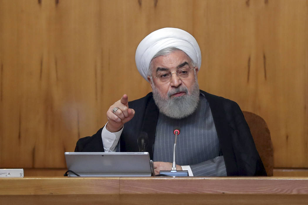 In this photo released by the office of the Iranian Presidency, President Hassan Rouhani speaks ...