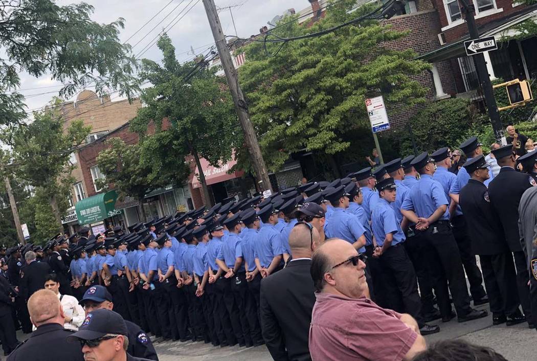 Hundreds of New York City police officers lineup for the funeral ceremony for Detective Luis Al ...