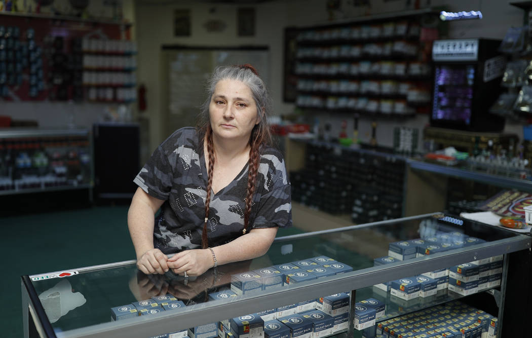 In this June 27, 2019, photo, Cheryl Luell, who runs The Healing Center, poses at the marijuana ...