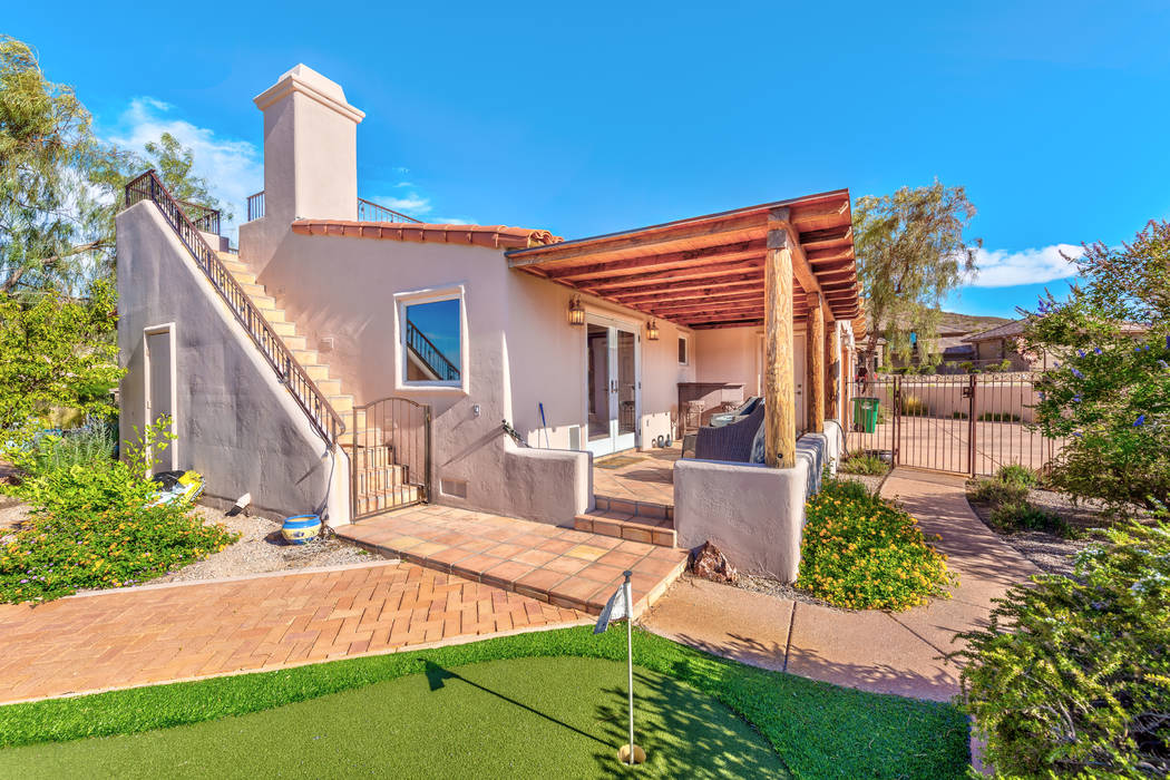 The two-story home has a putting green. (Desert Sun Realty)