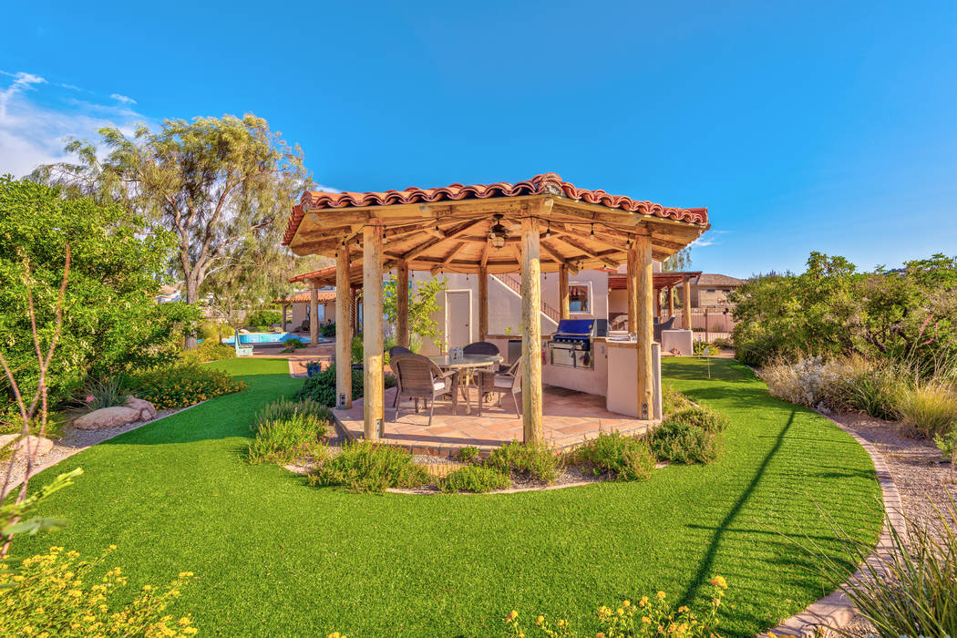 The outdoor kitchen has a wooden ramada. (Desert Sun Realty)