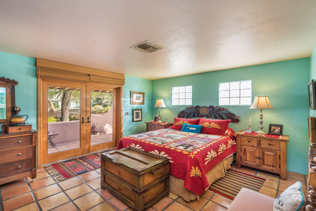 One of four bedrooms with a private patio entrance. (Desert Sun Realty)