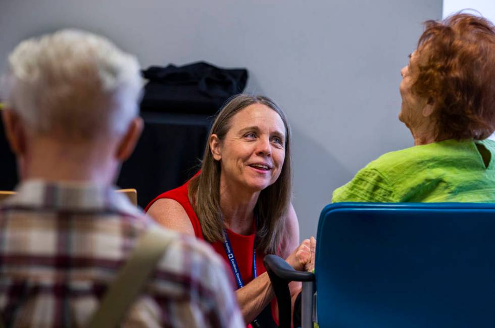 Administrative Assistant II Verla Niebuhr welcomes one of many participants during a Memory Caf ...