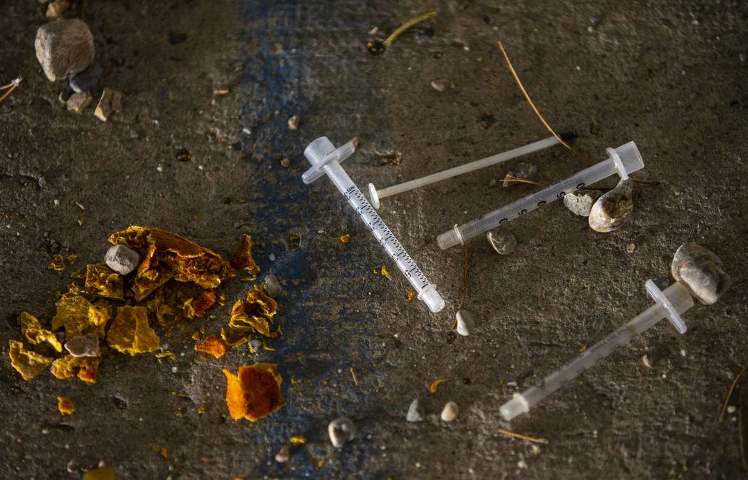 Spent needles litter the ground in a drainage ditch off of W. Tropicana Avenue. near S. Rainbow ...