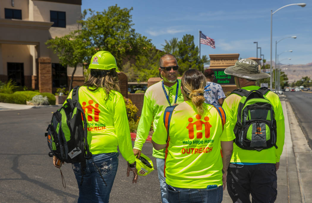 HELP of Southern Nevada Director of Crisis Teams Louis Lacey, center, coordinates the next move ...