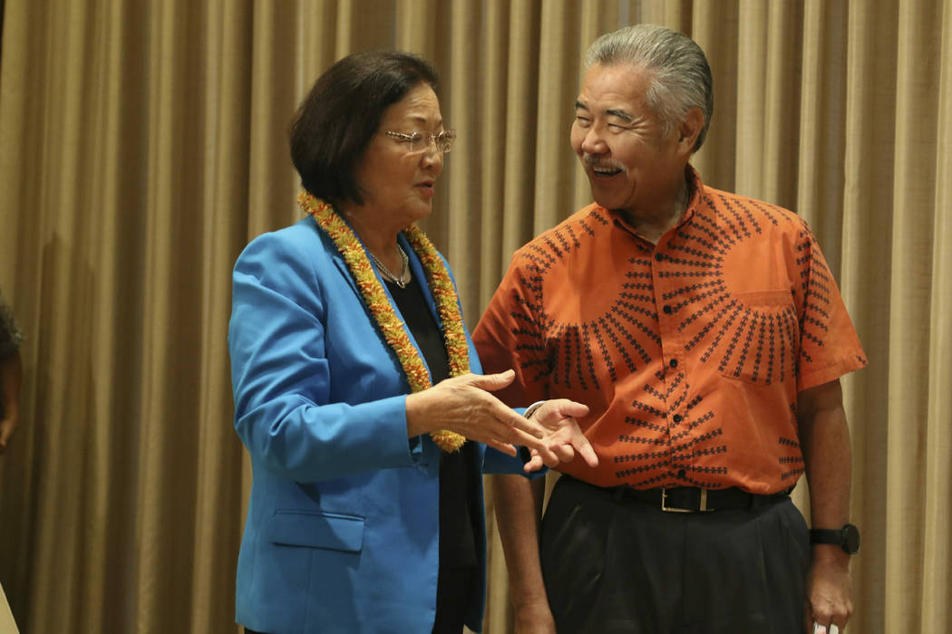 Hawaii Gov. David Ige, right, and U.S. Sen. Mazie Hirono chat before Ige signs bills in Honolul ...