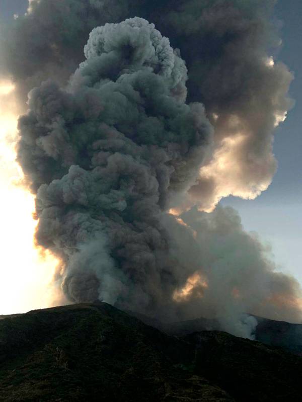 Smoke billows from the volcano on the Italian island of Stromboli, Wednesday, July 3, 2019. The ...