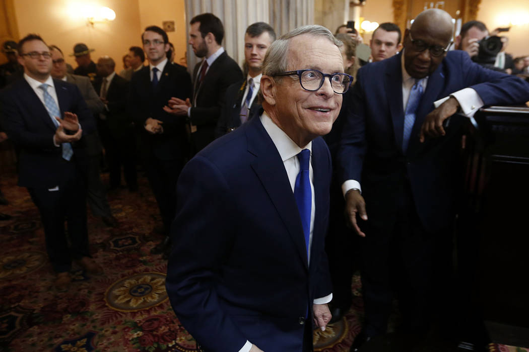 FILE - In this March 5, 2019 file photo, Ohio Governor Mike DeWine enters the Ohio House chambe ...