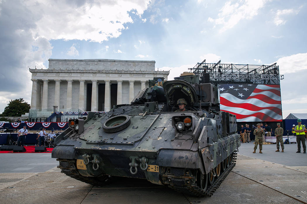 An Army driver with the 3rd Infantry Division, 1st Battalion, 64th Armored Regiment, drives a B ...