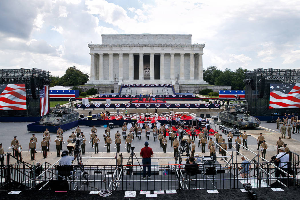 Two Bradley Fighting Vehicles flank the stage being prepared in front of the Lincoln Memorial, ...