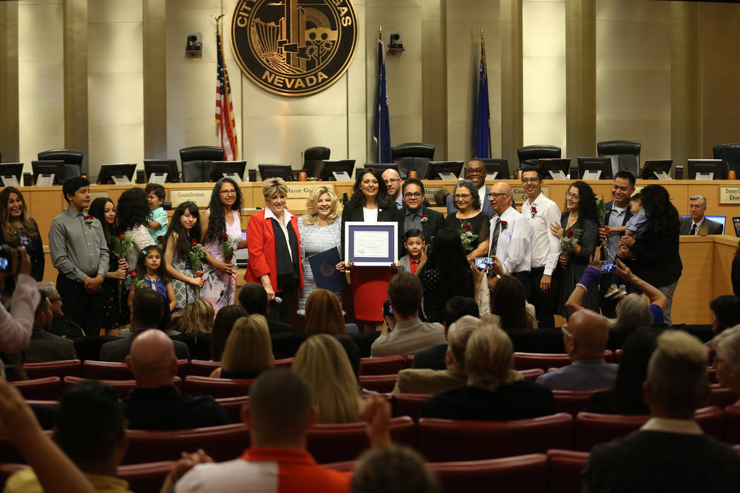 New Councilwoman Olivia Diaz, center, is photographed with her family and city dignitatries aft ...