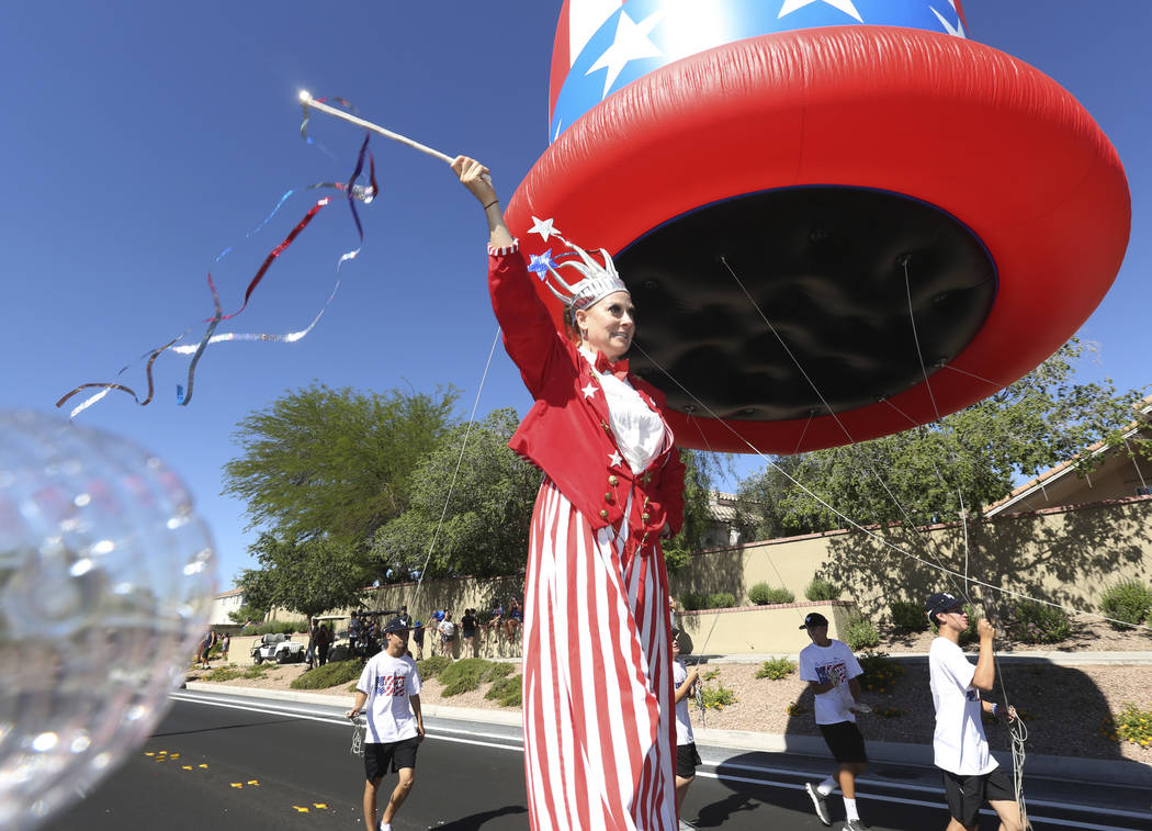 Sara Back waves her baton during the 25th annual Summerlin Council Patriotic Parade on July 4, ...