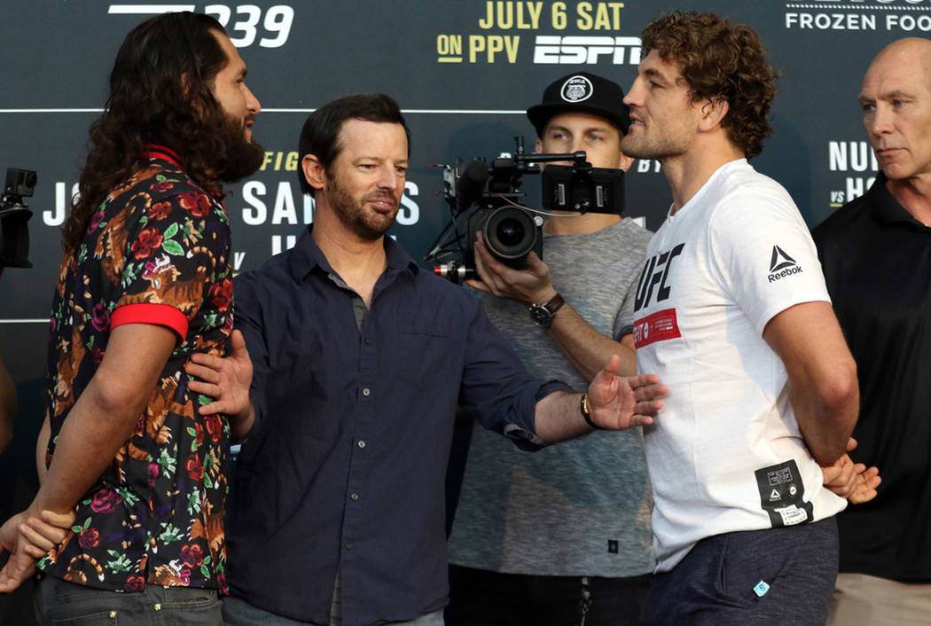 UFC welterweight Jorge Masvidal, left, and Ben Askren, right are separated by matchmaker Sean S ...