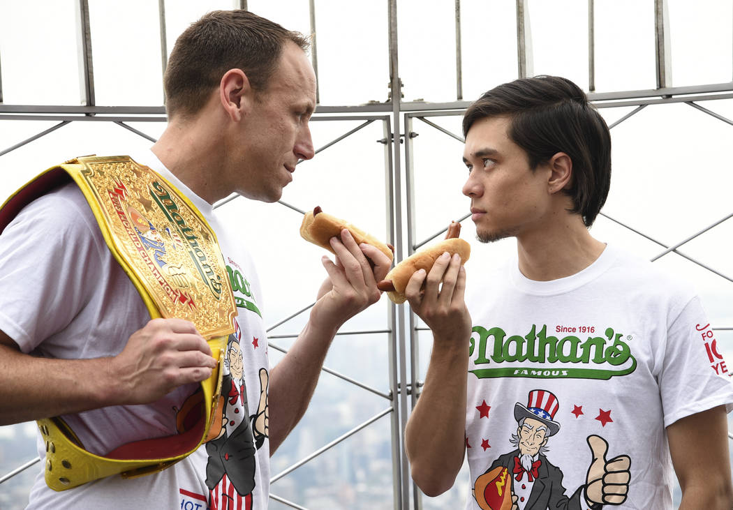 Eleven-time and defending men's champion Joey Chestnut, left, and former champion and number th ...