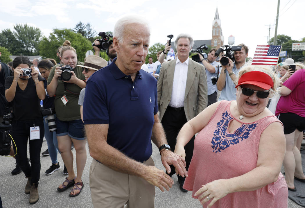 Former vice president and Democratic presidential candidate Joe Biden greets local residents wh ...