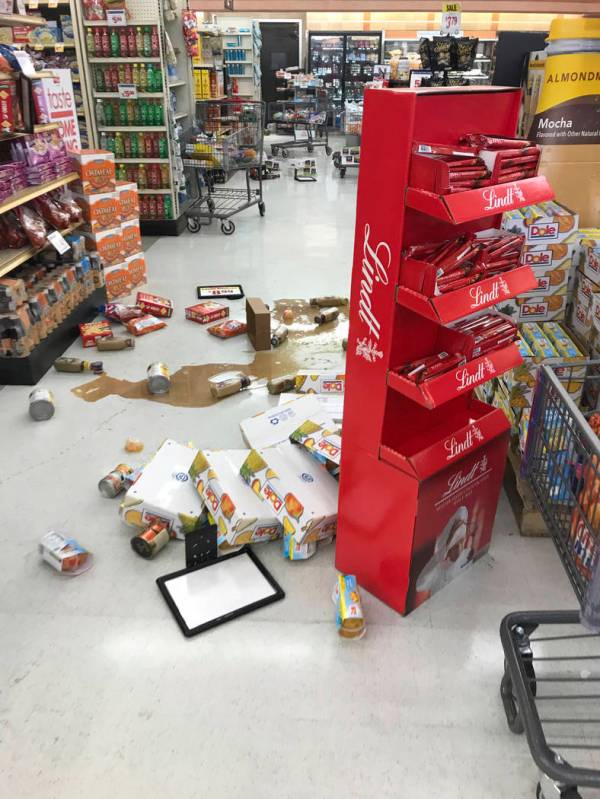 Food and other damaged merchandise are strewn on the floor at the Stater Bros after an earthqua ...