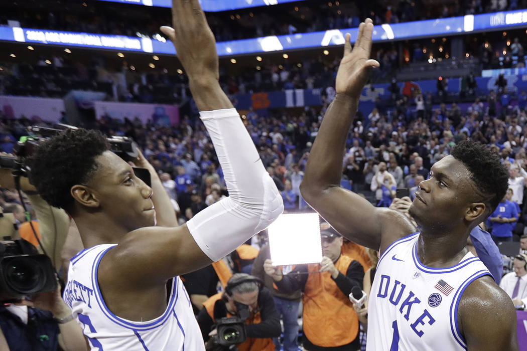 Duke's RJ Barrett (5) and Zion Williamson (1) celebrate after defeating Florida State in the NC ...