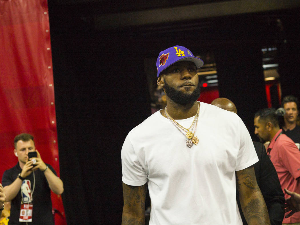 Los Angeles Lakers star LeBron James attends a basketball game between the Lakers and the Chica ...