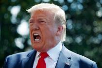 President Donald Trump talks to reporters on the South Lawn of the White House before departing ...