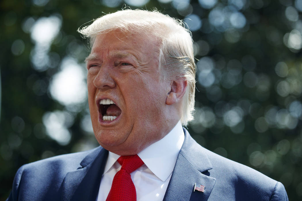 President Donald Trump talks to reporters on the South Lawn of the White House before departing ...