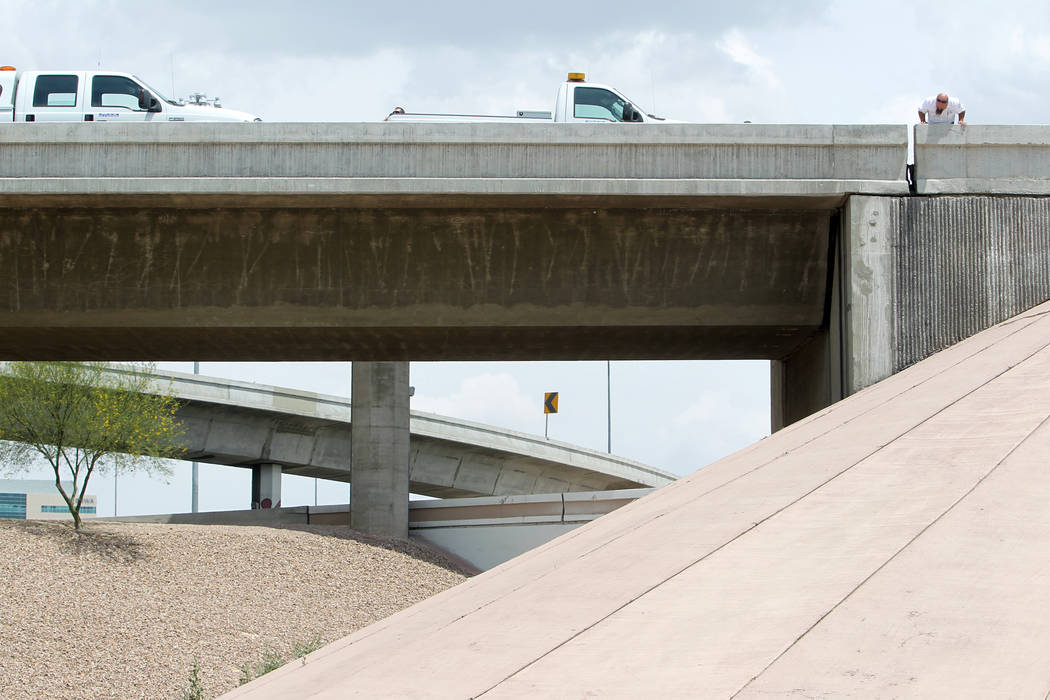 Officials from the Nevada Department of Transportation and Nevada Highway Patrol troopers inves ...