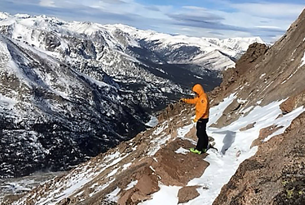 A search team member looks for Micah Tice on a ledge on the Keyhole Route in Rocky Mountain Nat ...