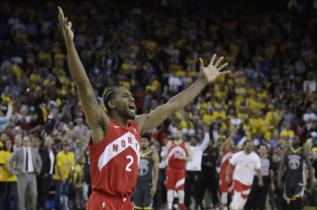 Toronto Raptors forward Kawhi Leonard celebrates after the Raptors defeated the Golden State Wa ...